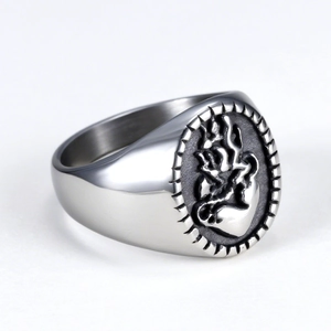 Gothic punk heart ring in silver stainless steel with flame relief design on grey gradient background