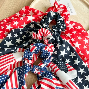 Set of three American flag bow scrunchies with long streamers in classic and vintage style