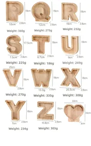 Detailed dimensions and weight specifications for wooden letter-shaped piggy banks