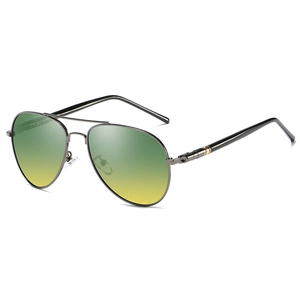 Detail view of polarized pilot sunglasses with gunmetal frame and yellow-green gradient lenses