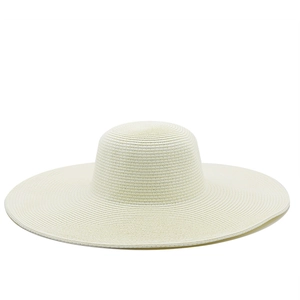 Top view detail of cream straw hat showing tight circular weave and 13cm wide brim