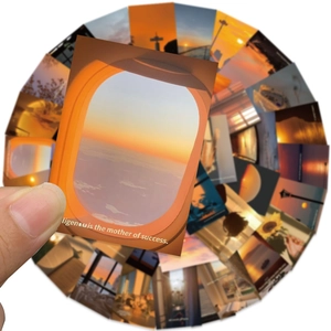 Macro shot of sunset sticker with airplane window view and motivational quote for journals