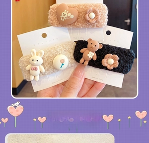Detailed view of plush lamb hair hairpins with cartoon bears and hearts in three colors