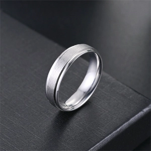 Detail view of 6mm matte titanium steel ring with brushed texture and polished beveled edges.