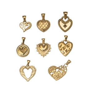 Set of eight gold stainless steel heart pendants with various textures and embossed designs