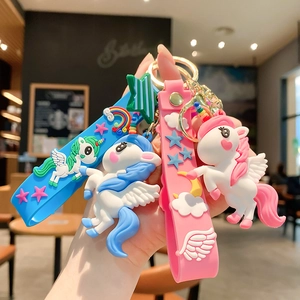 Cute silicone unicorn keychain set in pink and blue colors with golden metal rings