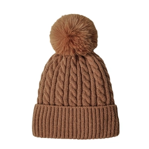 Winter cable knit beanie in caramel brown with fluffy faux fur pompom and ribbed cuff