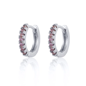 Close-up of silver hoop earrings featuring a row of pave-set round pink zircons