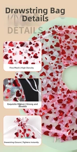Macro detail of high-density red organza gift bag with heart pattern and white drawstring
