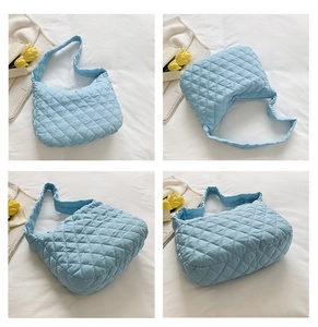 Detailed views of light blue quilted crossbody bag with soft puffer texture and large capacity