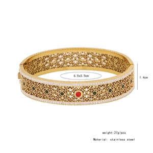 Detailed view of hollow gold tree of life bangle with crystals and product dimensions