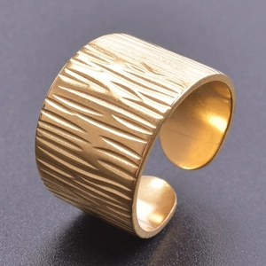 Adjustable gold stainless steel ring with modern vertical bark texture and wide band