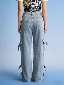 Women's light blue cargo jeans with bow tie ribbons and multiple utility pockets