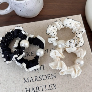 Vintage black and white polka dot scrunchies with lace trim and elegant pearls