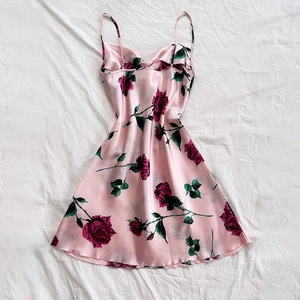 Pink satin slip dress featuring elegant red rose floral prints and slim shoulder straps