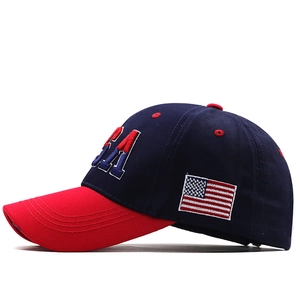 Detailed side view of navy baseball cap with red USA embroidery and American flag patch