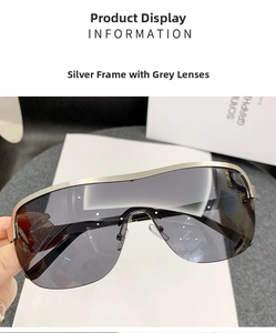Detail view of silver frame sunglasses with grey lenses and wrap-around visor design