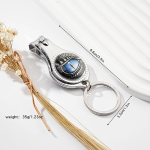 Silver dragon eye nail clipper keychain with dimensions 8.8x3.3cm and weight 35g shown