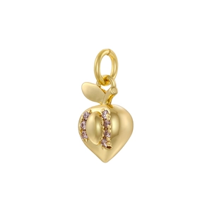 Close-up of a gold strawberry pendant with pink crystals and a metallic polished finish