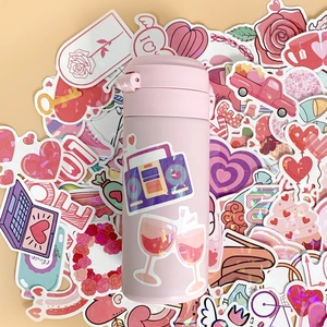 Holographic heart stickers decorated on pink tumbler for Valentine's DIY gift ideas