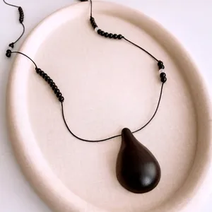 Minimalist wood water drop pendant necklace with black and white resin beads