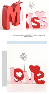 Detail of wooden Miss and Love letter stands with metal photo holder clip for desk