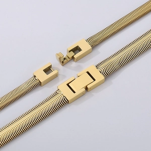 Flat herringbone snake chain necklace in gold finish with secure folding clasp closure