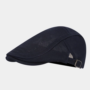 Macro detail of the breathable mesh weave and metal side buckle on this flat ivy cap