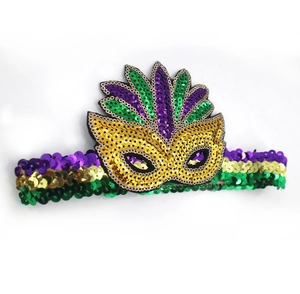 Detail of Mardi Gras earrings featuring purple, green, and gold sequins with feather mask charms