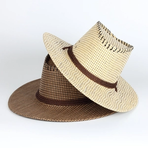 Detail of wide brim straw cowboy hats with braided ropes and black stitching edges