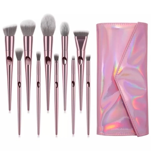 10-piece holographic makeup brush set with pink metallic handles and matching pouch