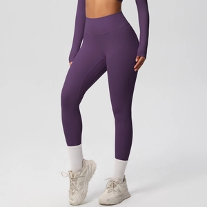 Detail of high-waist purple yoga leggings with supportive tummy control waistband