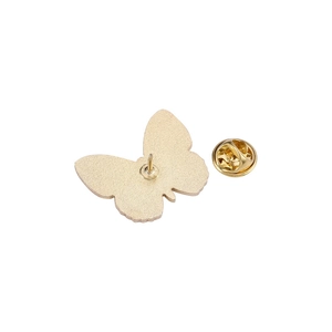 Golden butterfly-shaped alloy brooch pins with butterfly clutch backings on white background