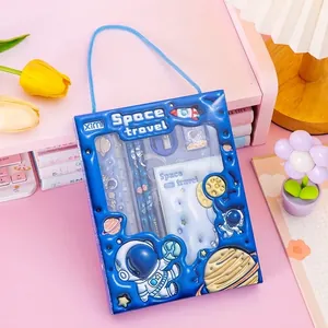 Macro view of space-themed stationery set box with 3D astronaut and rocket relief designs