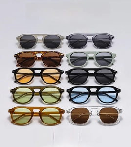 Flat lay of retro oversized sunglasses set in various colors and tinted lenses