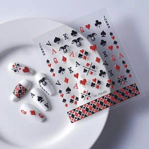 5D embossed poker nail art stickers with 3D Joker and playing card patterns on white surface