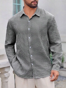 Detail shot of men's slim-fit long-sleeved shirt with green and white seersucker texture