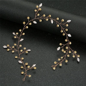 Detail of gold woven wire bridal headband with white leaf charms and beads