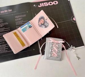 Detail of ballet style PU leather card wallet with ribbon bow and pearl pendant charm