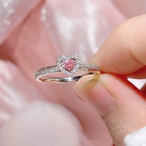 Elegant adjustable silver ring featuring a pink heart-shaped zircon with halo pavé setting