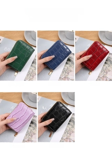 Mini crocodile pattern card holders in five colors with a compact zipper design