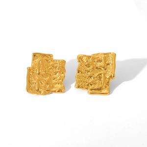 Macro shot of 18K gold plated stainless steel earrings with irregular hammered texture
