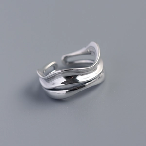 Detailed close-up of double-layer S925 sterling silver ring with irregular wave design