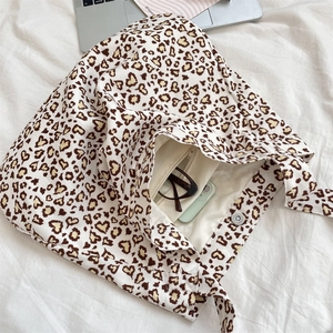 Top view of leopard heart print canvas tote bag showing interior magnetic closure and zip pocket