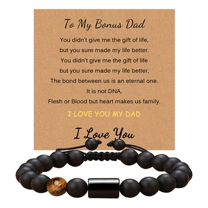Detail of matte black bead bracelet with tiger eye stone and Bonus Dad message card