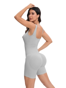 Detail of grey seamless yoga jumpsuit showing ribbed stretch fabric and racerback design
