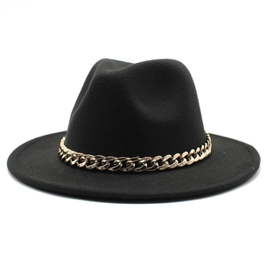 Detailed side view of black wool felt fedora hat featuring a chunky gold chain strap
