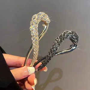 Elegant rhinestone twisted hair clips in gold and gunmetal finish for women's styling