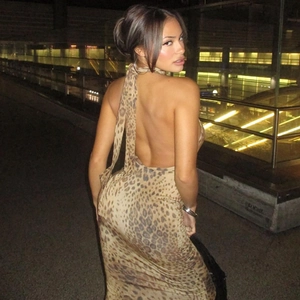 Detail of the backless halter design and leopard print fabric on a bodycon summer dress