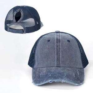 Detail view of washed denim ponytail baseball cap with breathable mesh and distressed brim